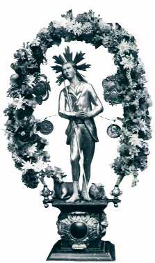 Bild: Das Heiligenbild der Älperbruderschaft (Helg) stellt die Figur des St. Wendelin mit dem Hirtenstab dar, flankiert von einer Kuh und einem Schaf.